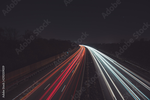 Traffic light trails highway at night