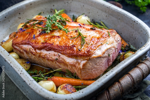 Bild auf Leinwand Traditional roasted dry aged veal tenderloin with carrots and onions offered as