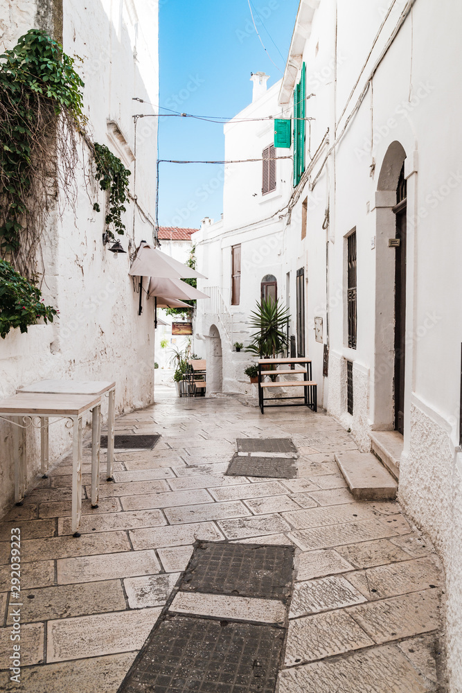 Ostuni, Italy - August 2019: Historic center of white city of Ostuni in Puglia, in a day of August