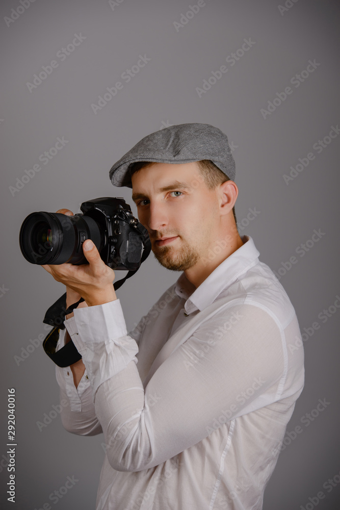 Young man using a professional camera Young man using a professional camera