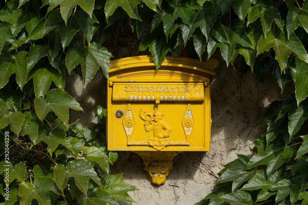 Yellow old german "Briefkasten" Mailbox between Vine leaves at the Hornberg  Castle Stock Photo | Adobe Stock