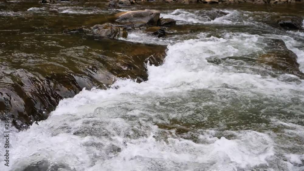 Boiling water of a mountain river in the mountains in summer Boiling water of a mountain river in the mountains in summer