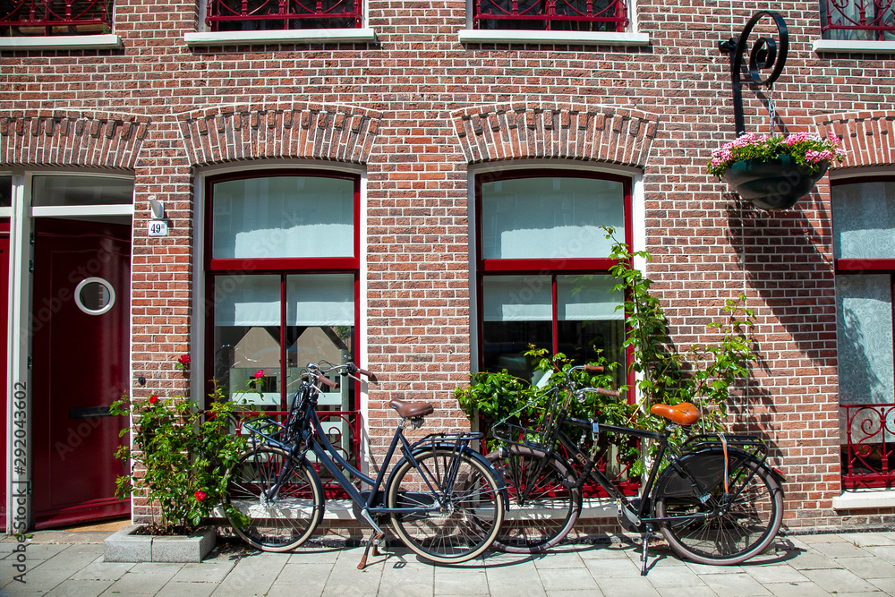 Two bicycles parked on street. Common scene in Amsterdam Netherlands