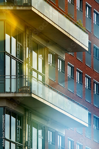 balconies and windows on the facade of a modern multi-storey building  blurred background