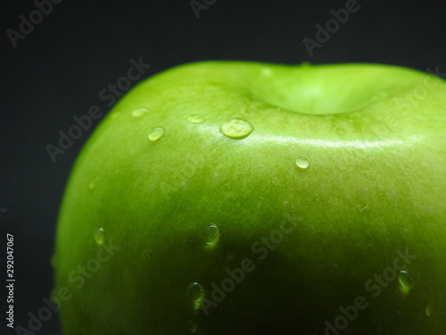 green apple with water drops