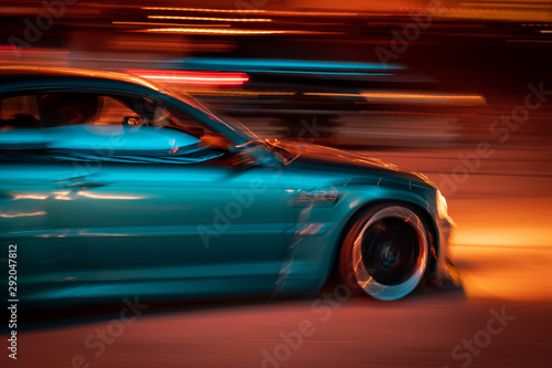 marina blue car racing at night © Dan
