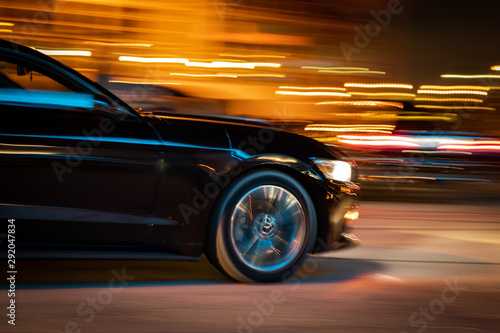 black car racing at night © Dan