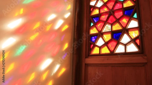 Beautiful stained glass windows with sunlight in the background