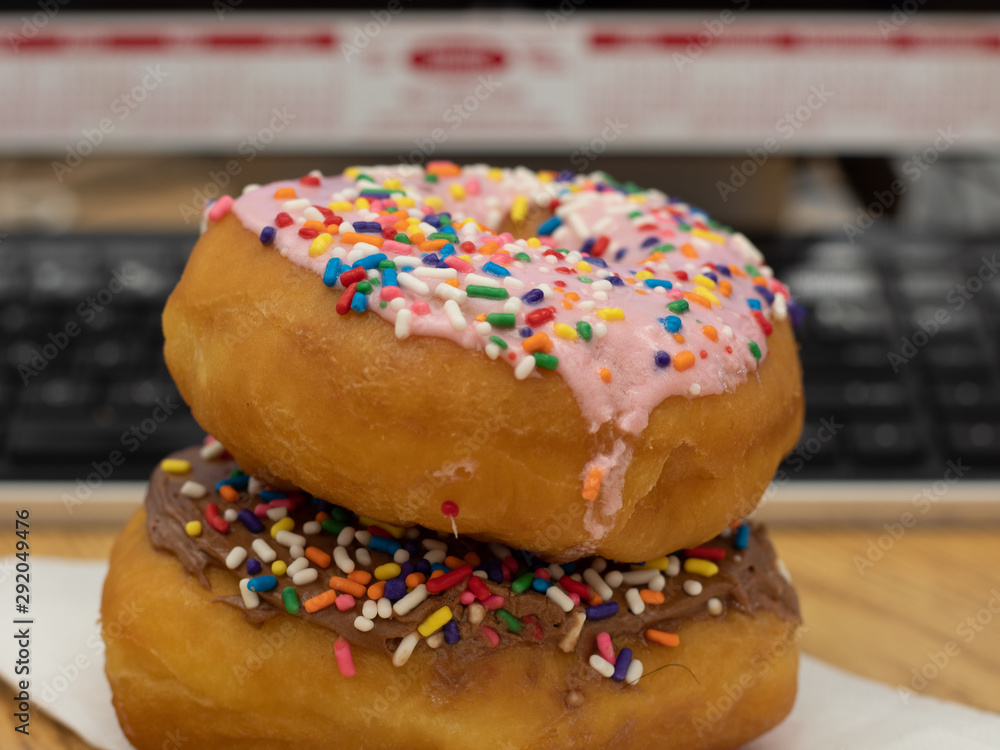 Close Up Iced Donuts on a Desk Close Up Iced Donuts on a Desk