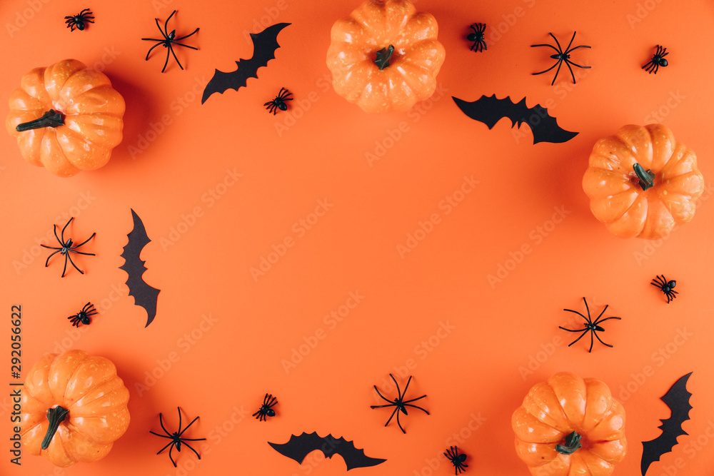 Halloween decorations on the orange background. Flat lay concept, top view, copy space Halloween decorations on the orange background. Flat lay concept, top view, copy space
