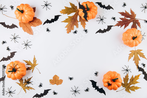 Halloween concept. Pumpkins  dried leaf  spiders and bats on white background. Flat lay  top view  copy space