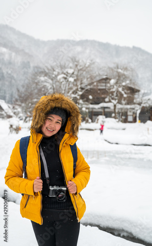 Woman travel in Japan., Winter portrait of young Asian beautiful woman in snow. Snowing winter beauty fashion concept at Japan.