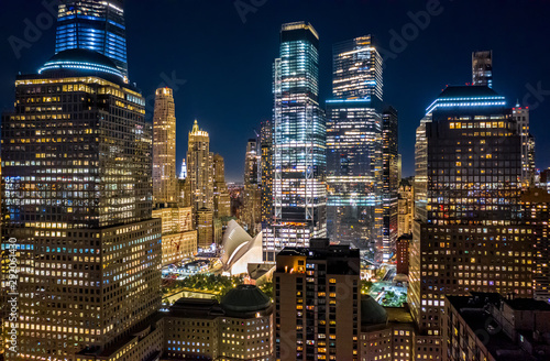 Aerial drone view of New York skyscrapers at night in Lower Manhattan