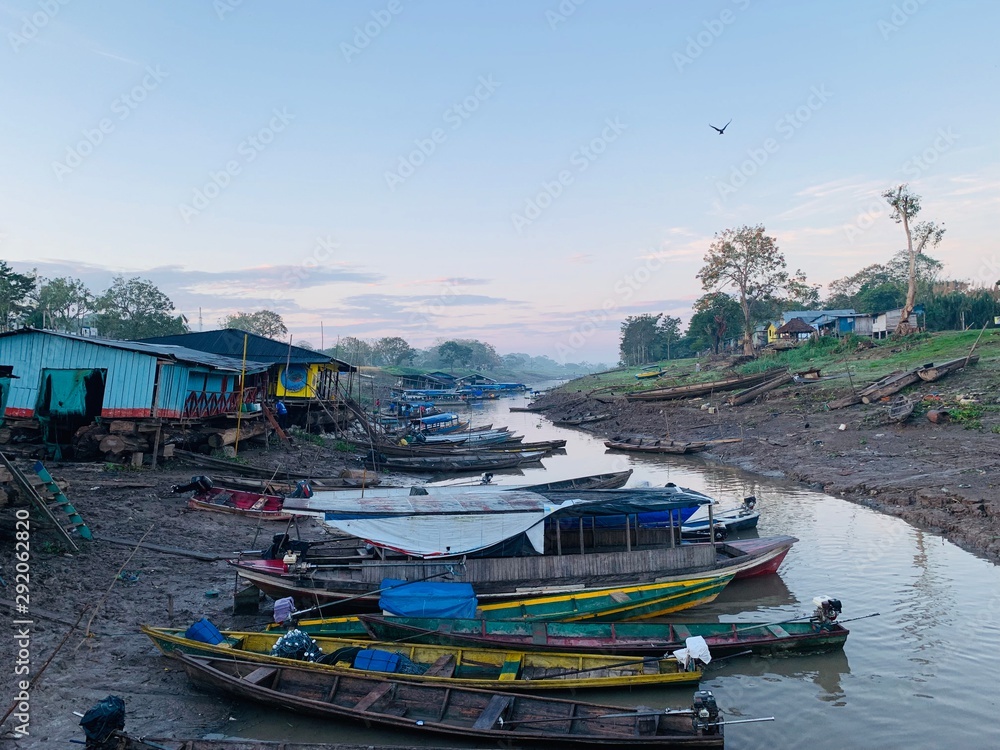 Boats on river bank