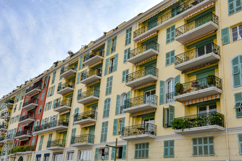 Colourful buildings with balconies by Nice old port in France