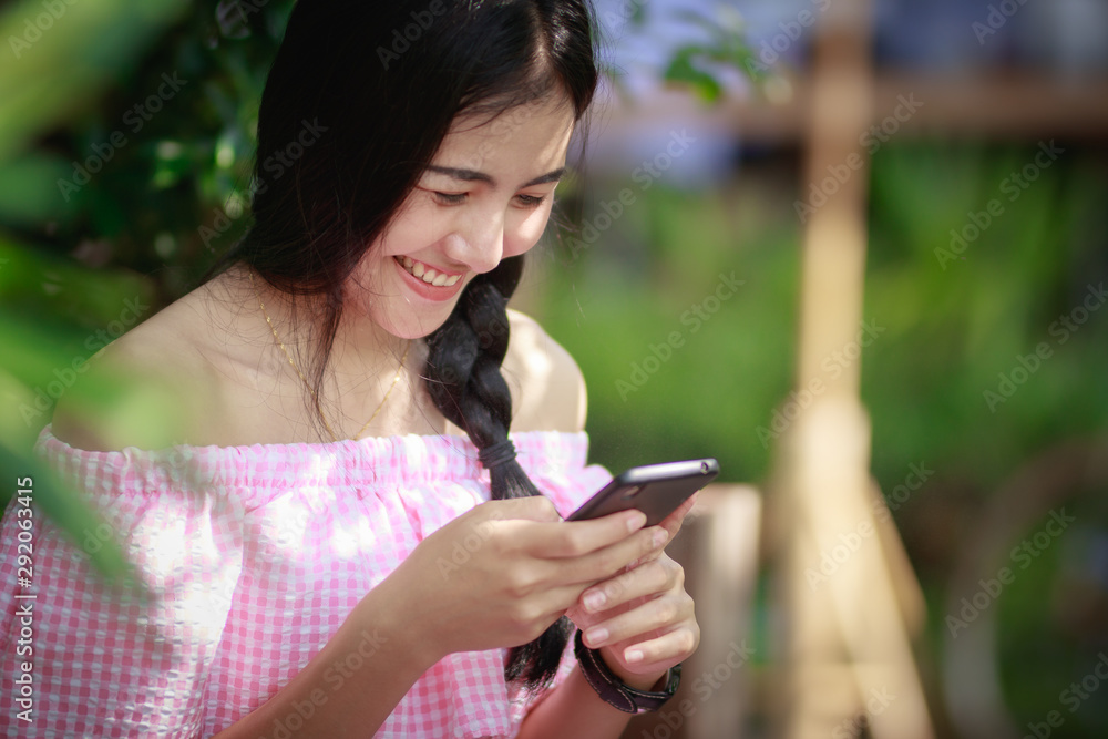 Asia woman using smartphone working,playing with happy. Asia woman using smartphone working,playing with happy.