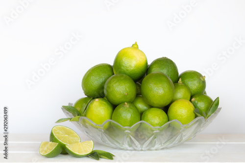 lemon in the bowl on whhite isolated background.