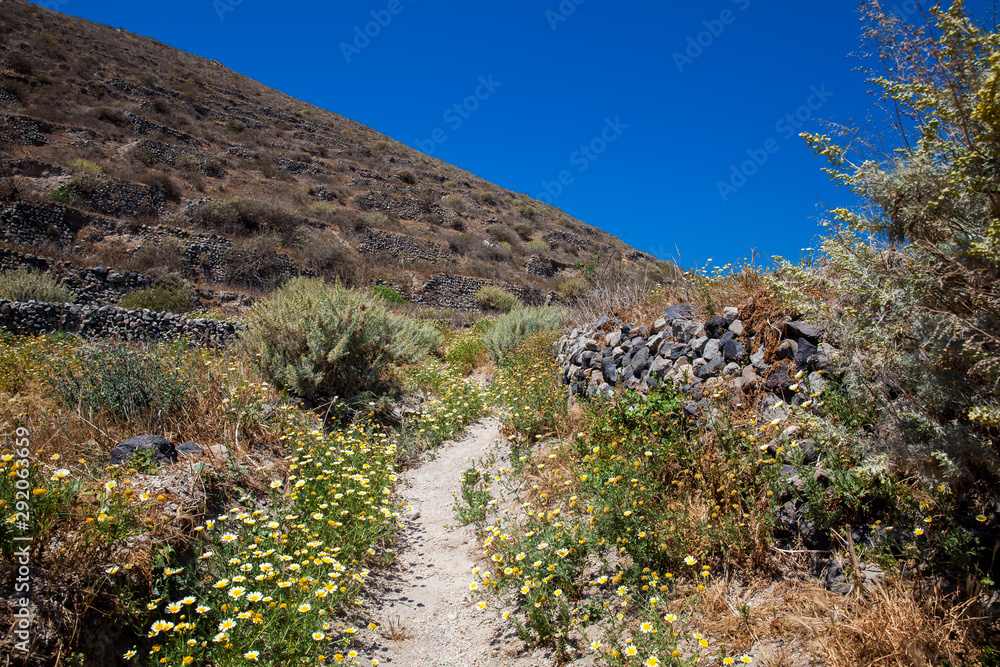 Walking path number 12 to Akrotiri village in Santorini Island in a beautiful early spring day