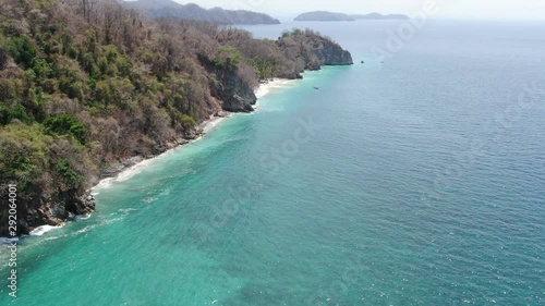 Aerial drone video of a tropical paradise beach in Playa Quesera in Curu, Costa Rica photo