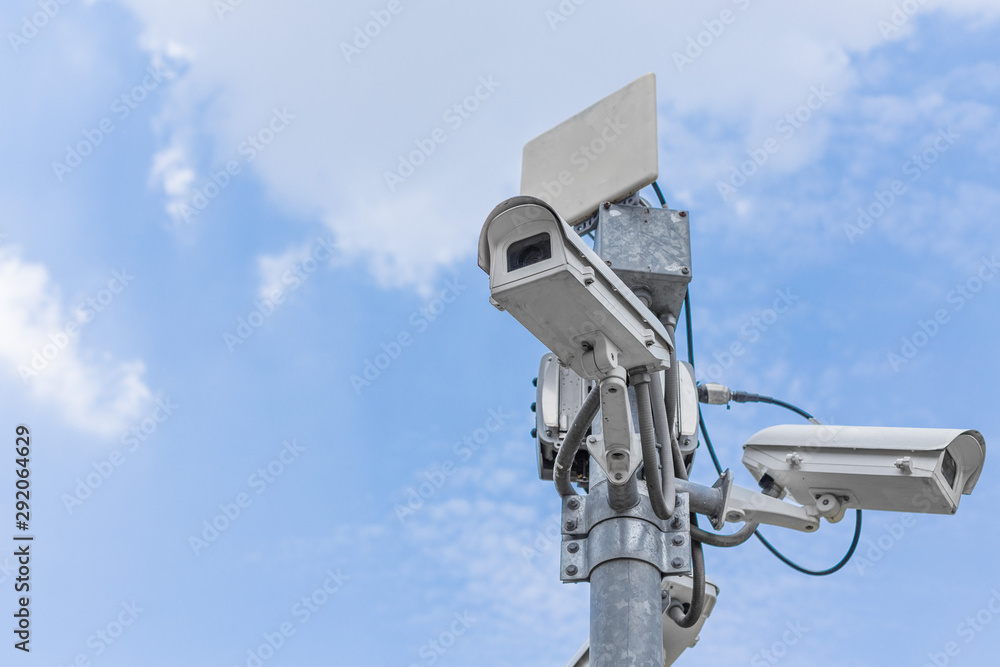 CCTV on the blue sky background With buildings in the city CCTV on the blue sky background With buildings in the city