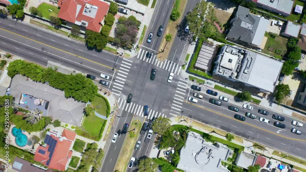 Suburb Intersection Los Angeles. Aerial. 4K. Drone rises above the intersection of the ...