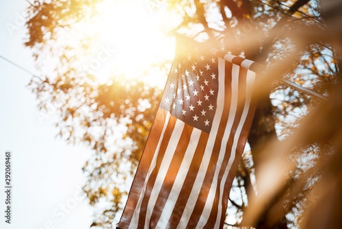 Low nalge shot of united states flag with a blurred background on a sunny day