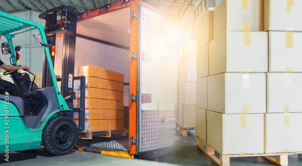 double exposure of forklift loading packaging boxes into shipping cargo ...