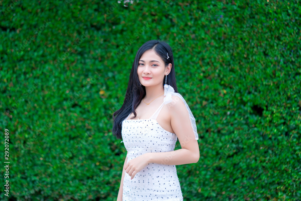 Portrait of Beautiful young woman with summer green park background Portrait of Beautiful young woman with summer green park background