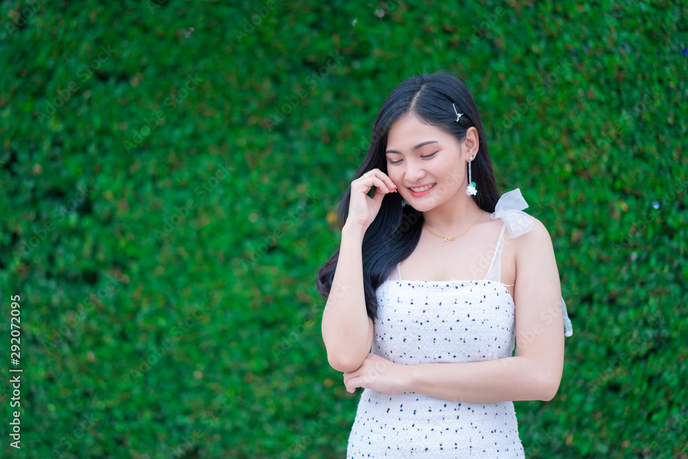 Portrait of Beautiful young woman with summer green park background Portrait of Beautiful young woman with summer green park background