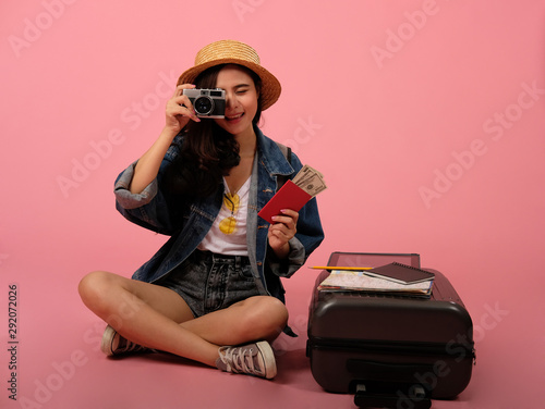 woman backpacker traveler with camera passport. journey trip travel. studio shot
