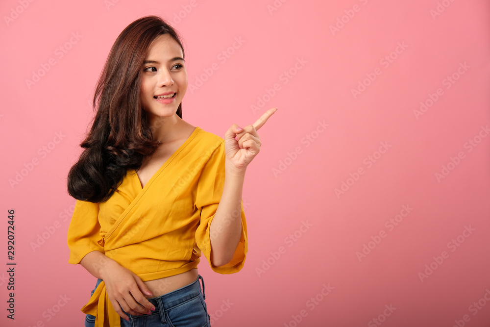 portrait of smiling asian woman in casual clothing. studio shot portrait of smiling asian woman in casual clothing. studio shot