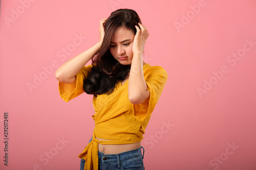 studio portrait of asian woman in casual clothing feeling stressed unhappy depressed