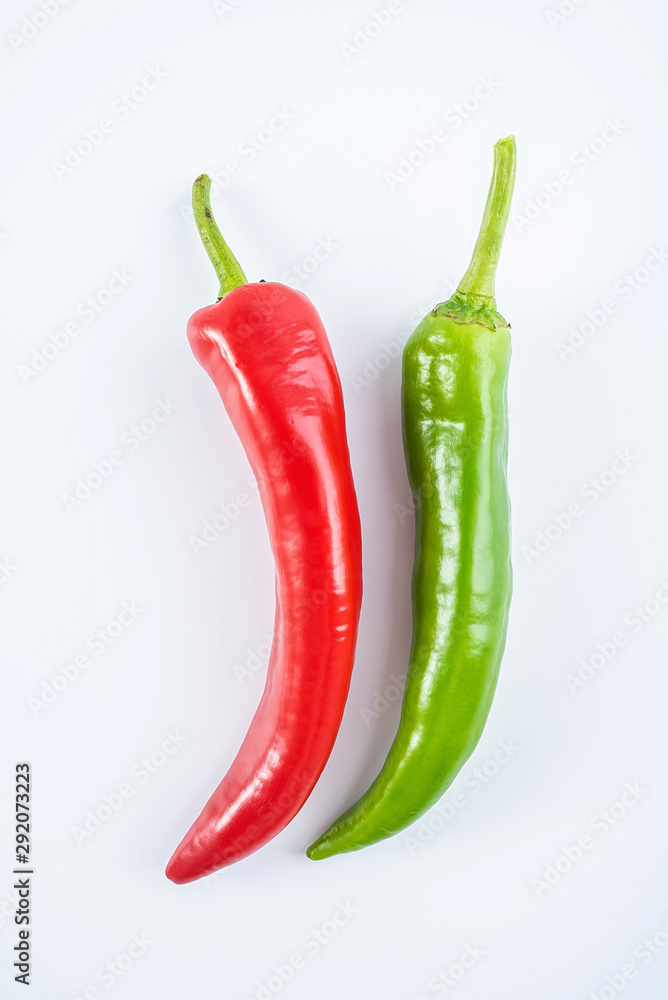 Fresh red pepper and green pepper on white background