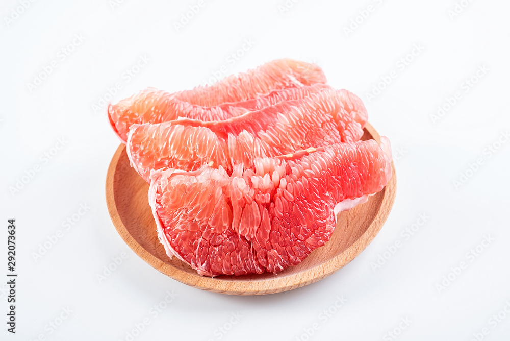 a plate of fresh red grapefruit meat on a white background a plate of fresh red grapefruit meat on a white background