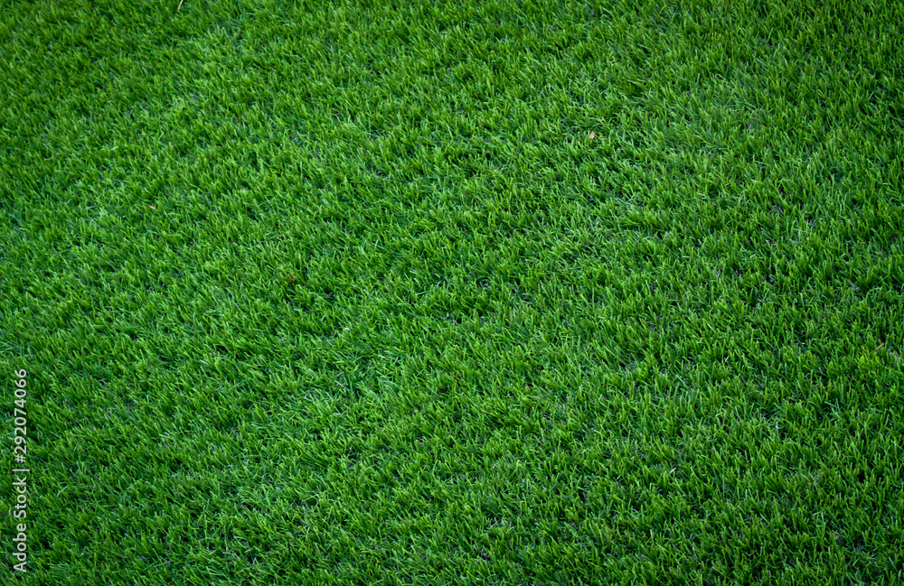 Obraz premium Grass. green grass background. Green artificial turf pattern, texture for background. Grass meadows top view. artificial grass texture on playground, grass texture on football field or golf. banner.