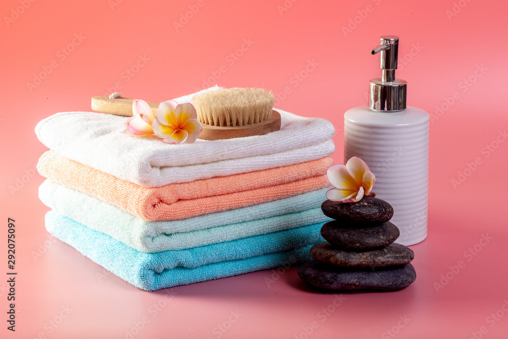 Spa cosmetics. Plumeria flowers on a pink background. Spa cosmetics. Plumeria flowers on a pink background.