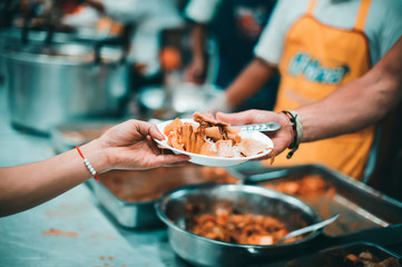 Philanthropists donate food and help the poor : concept of feeding