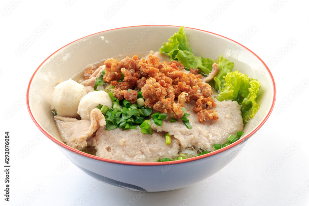 Thai Noodles with pig machine and meat ball and fresh vegetables and warm soup on white background Thai Noodles with pig machine and meat ball and fresh vegetables and warm soup on white background