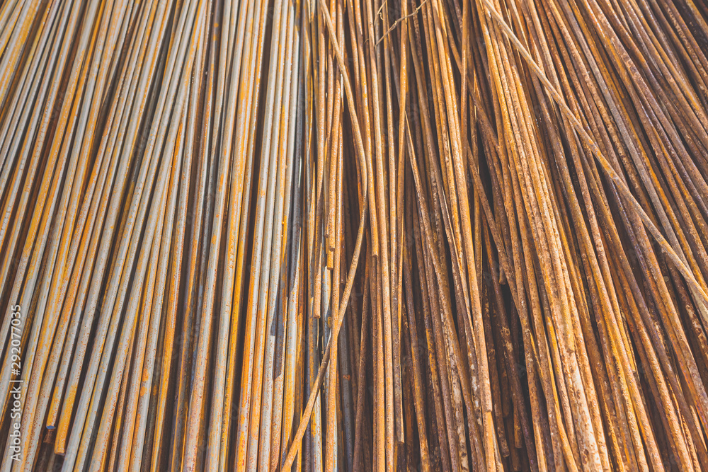 Background texture of old rusty steel bars construction materials in a construction site Background texture of old rusty steel bars construction materials in a construction site
