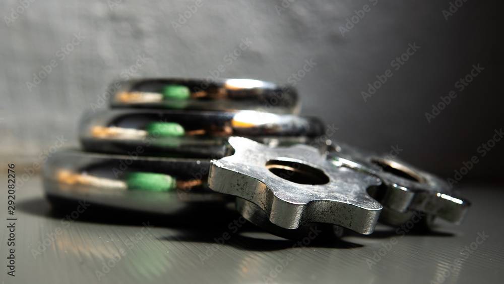 Metal dumbbell equipment with wall background. Metal dumbbell equipment with wall background.