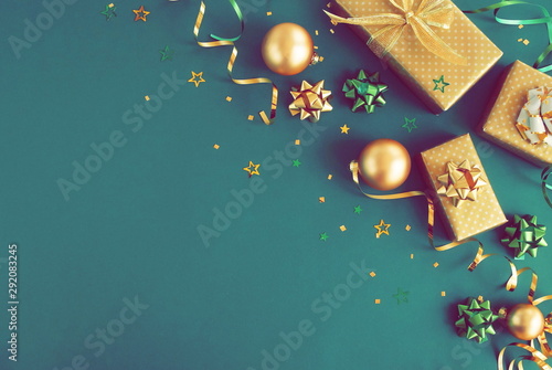 christmas or new year frame decorations in gold colors on dark mint backgroun...