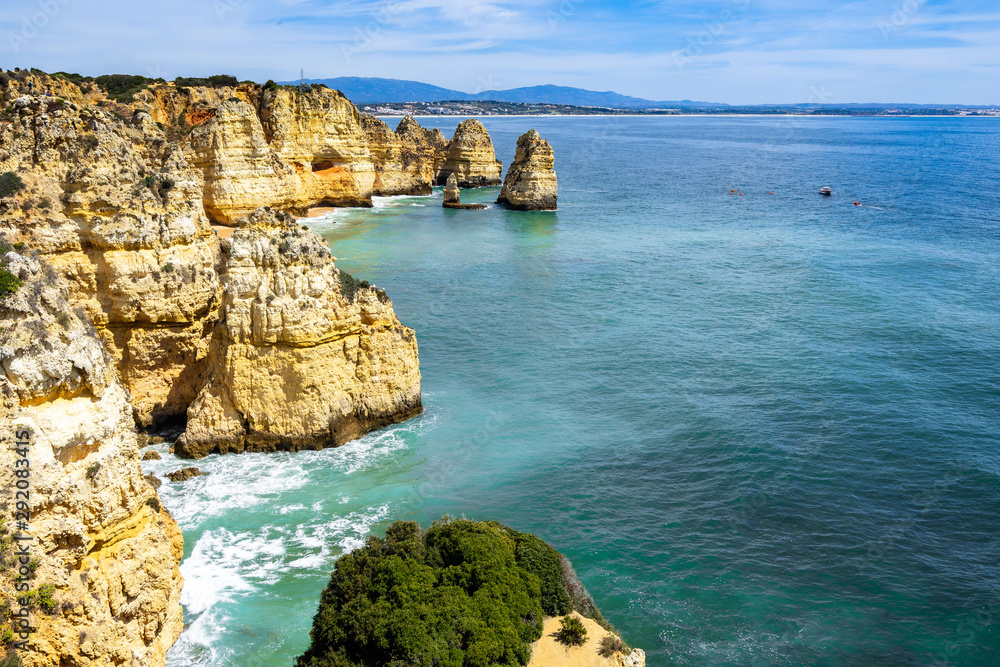 Fototapeta premium Scenic natural landscape of Algarve coastline near Lagos with cliffs overlooking the Atlantic Ocean, Portugal
