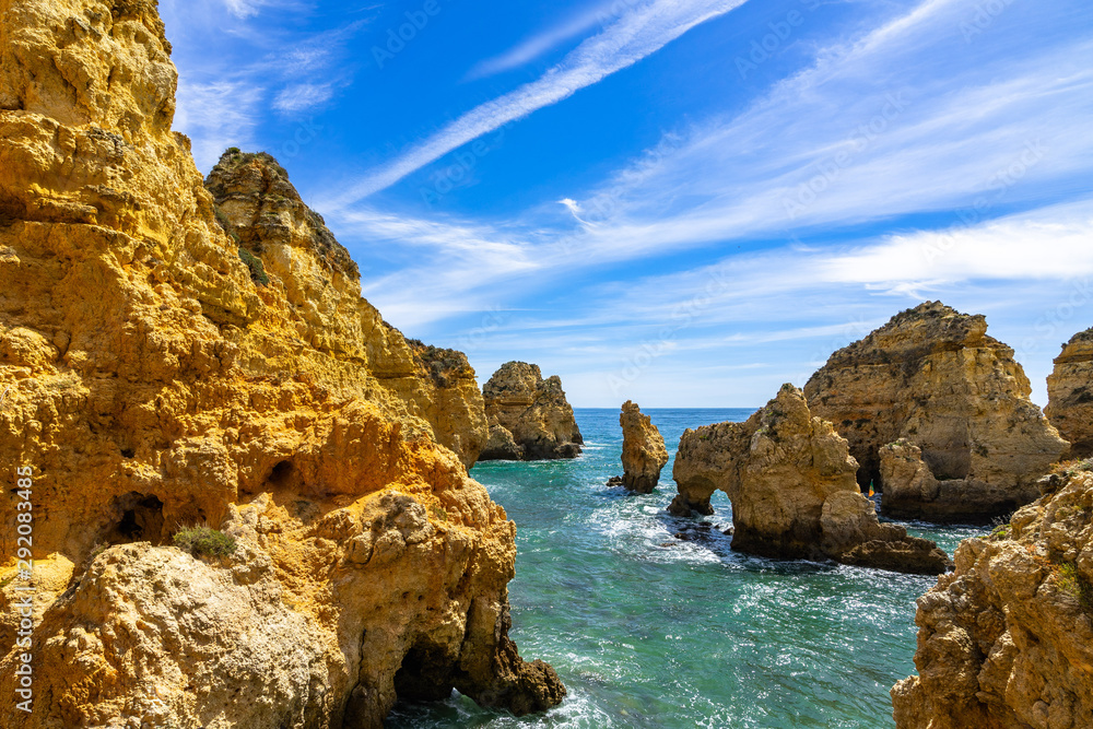 The golden cliffs and turquoise ocean waters at Ponta da Piedade, one of the most iconic landscape of Algarve, Portugal
