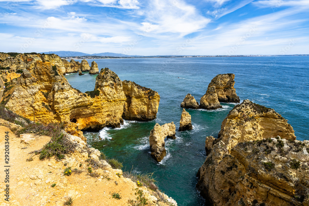 Algarve cliffs and coastline overlooking the Atlantic ocean viewed from Ponta da Piedade, Portugal