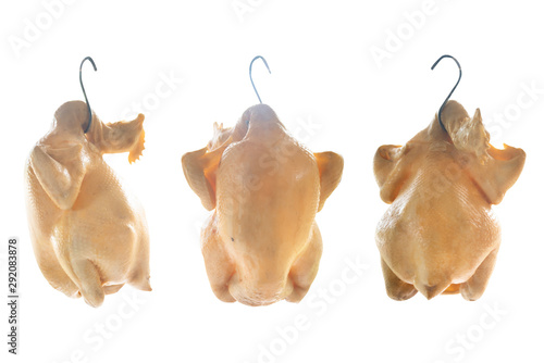 Fotografie Boiled whole chicken(Capon) hanged at the food vendor isolated on white