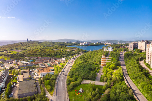Murmansk, Russia - July 1, 2019: Aerial view memorial Lighthouse, church and anchor monuments, Panorama northern city. Cargo Port gulf of sea