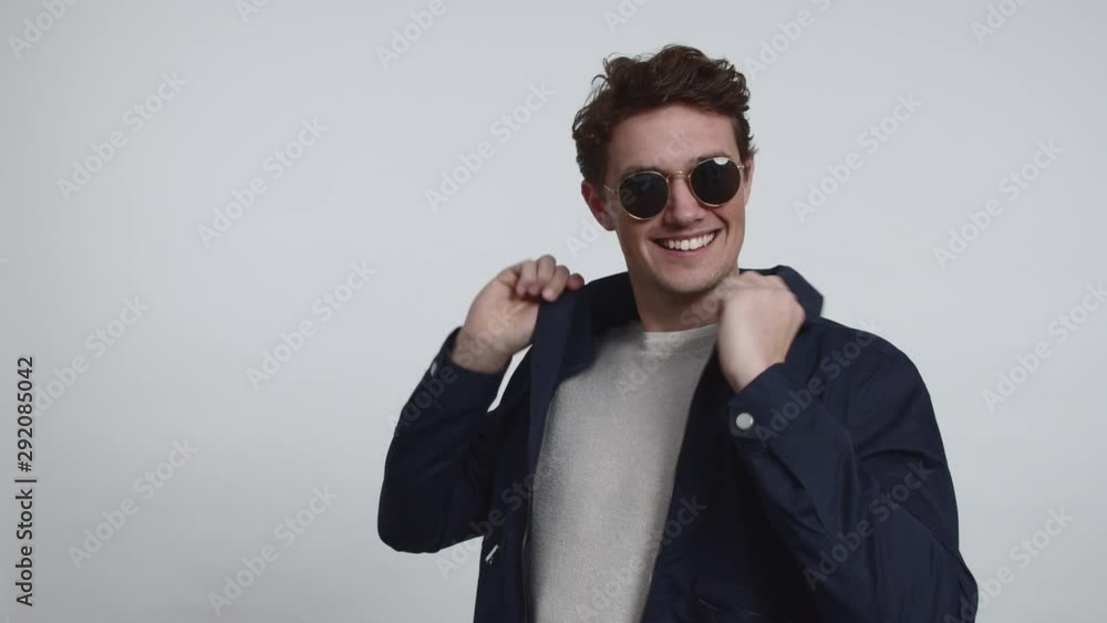 Fashion Model Wearing Sun Glasses and Posing for the Camera Fashion Model Wearing Sun Glasses and Posing for the Camera