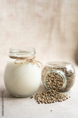 vegan fresh milk from hemp seeds in a glass jar, clean eating, non-dairy milk