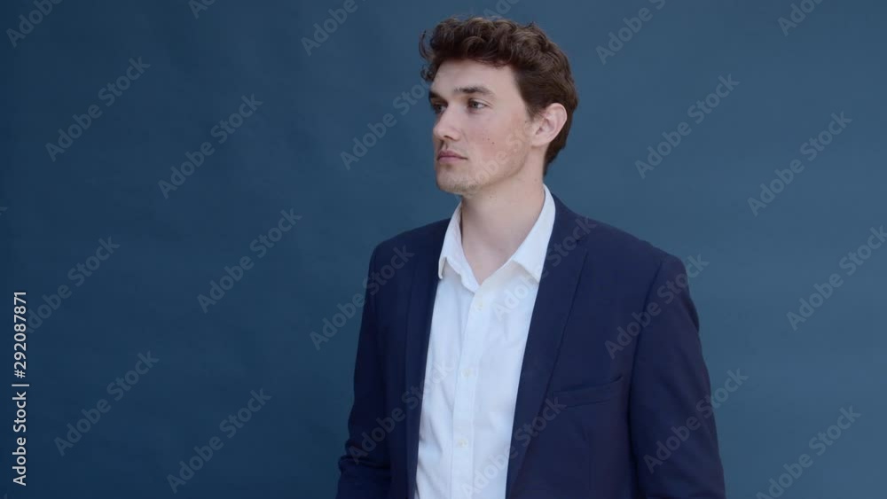 Handsome Male Model in Business Attire Smiling at the Camera Handsome Male Model in Business Attire Smiling at the Camera