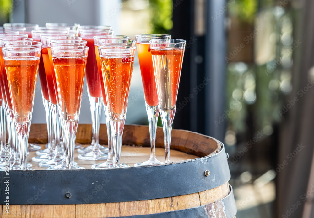 Fotografie Tall glasses filled with sparkling wine